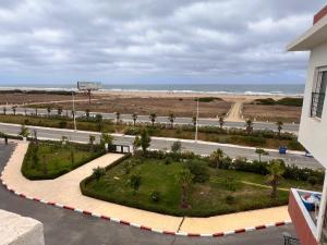 a view of the beach from the balcony of a building at Ventana al mar in Tangier