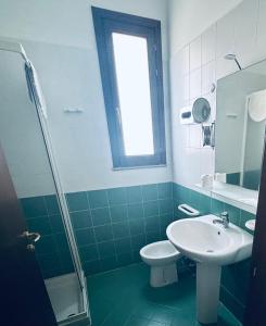 Koupelna v ubytování Hotel Achibea
