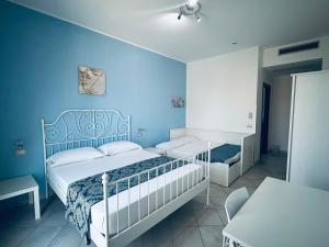 Postel nebo postele na pokoji v ubytování Hotel Achibea