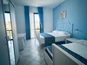 Postel nebo postele na pokoji v ubytování Hotel Achibea