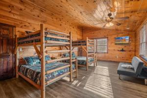 a bedroom with three bunk beds in a cabin at Apalachee Pool lodge in Cosby +41 photos
