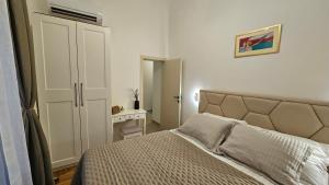 Postel nebo postele na pokoji v ubytování Villa Lucija