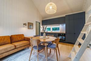 a living room with a table and a couch at Kalakuninga Puhkemaja in Liimala