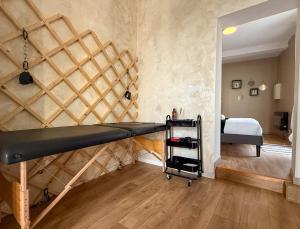 a room with a loft bed and a bedroom at T2 en centre-ville d'Illiers-Combray - parking- lit king size - terrasse in Illiers