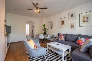 a living room with a couch and chairs and a table at Special TRIO PICASSO Apartment Basel, Bahnhof Grossbasel 10-STAR in Basel