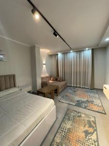 a large bedroom with a bed and a couch at CHALET IN HURGHADA SCANDIC ReSORT in Hurghada +4 photos