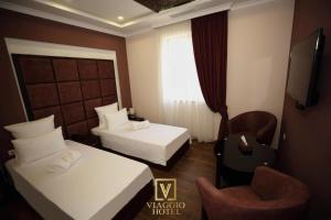 Letto o letti in una camera di VIAGGIO Hotel BY VG