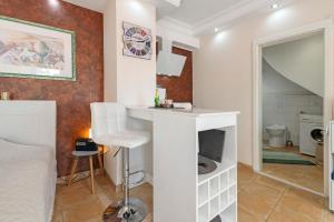a room with a bed and a bathroom with a sink at Apartment in der City in Sankt Wendel +13 photos