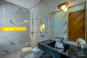 a bathroom with a sink and a mirror at Villa Mareva & Spa Marrakech in Marrakesh +132 photos