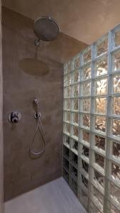 a shower with a wall of wine racks at Château Foncine in Foncine-le-Bas