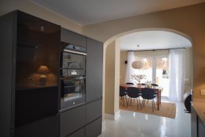A kitchen or kitchenette at UNIQUE Homes Lajares - Only Adults