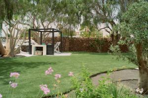 A garden outside UNIQUE Homes Lajares - Only Adults