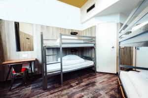 Кровать или кровати в номере Kabannas Newcastle
