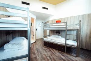 Кровать или кровати в номере Kabannas Newcastle