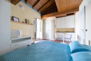 Кровать или кровати в номере Appartamenti Vistaqua