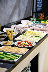 a buffet with many plates of food on a table at Edirne Gezgin Hotel in Edirne +45 photos