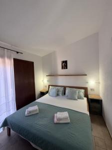 Postel nebo postele na pokoji v ubytování Villa Oliva