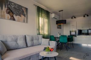 a living room with a couch and a table at Apartment Angie in Lastovo