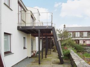 a stairway leading up to a building with a balcony at Ffestiniog View in Porthmadog