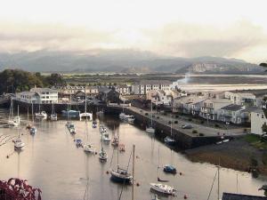a group of boats are docked in a harbor at Ffestiniog View in Porthmadog +7 photos