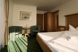 Postelja oz. postelje v sobi nastanitve Hotel Martini Kaprun - including summercard & breakfast