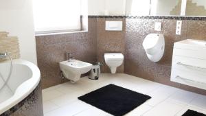 Ein Badezimmer in der Unterkunft Villaci Business Apartments