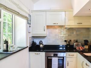 Køkken eller tekøkken på Woodland Retreat