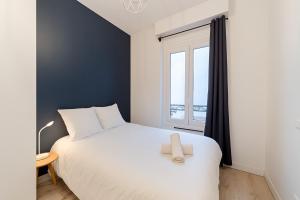 Ένα ή περισσότερα κρεβάτια σε δωμάτιο στο Cozy T2 near Part-Dieu 4 people Lafayette District