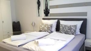 Ein Bett oder Betten in einem Zimmer der Unterkunft Villaci Business Apartments