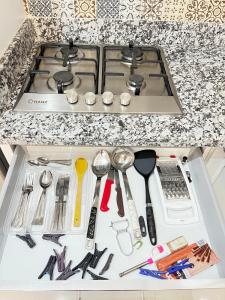 a drawer filled with utensils on a kitchen counter at La Casa Luminosa 3 in Larache