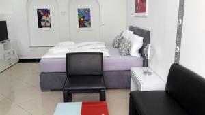 Ein Bett oder Betten in einem Zimmer der Unterkunft Villaci Business Apartments