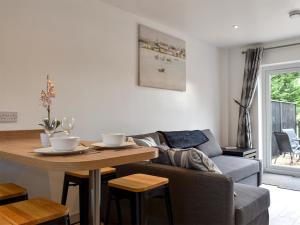 a living room with a couch and a table at Oak - Uk11993 in Greenhill