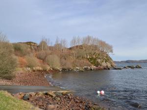 a river with two balls in the water at Cuckoos Nest in Cove