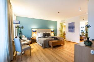 Ein Bett oder Betten in einem Zimmer der Unterkunft Seehotel am Kaiserstrand