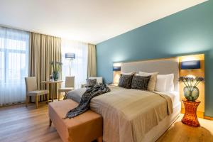 Ein Bett oder Betten in einem Zimmer der Unterkunft Seehotel am Kaiserstrand