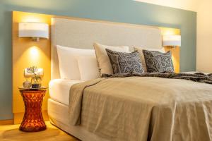 Ein Bett oder Betten in einem Zimmer der Unterkunft Seehotel am Kaiserstrand