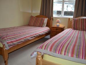 Ένα ή περισσότερα κρεβάτια σε δωμάτιο στο Claife View Windermere