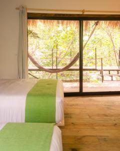 Cama o camas de una habitación en Hotel Noga