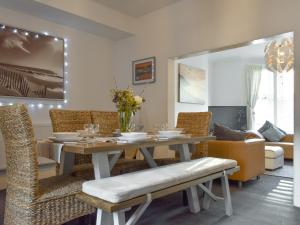 a dining room with a table and chairs at Driftwood in Scarborough