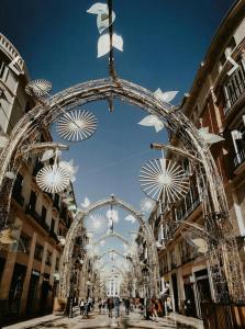 an archway in a city with people walking around at Functional and Compact Studio in the Historic Center in Málaga