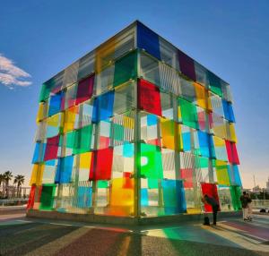 a multicolored building with people standing in front of it at Functional and Compact Studio in the Historic Center in Málaga