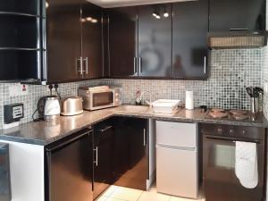 Køkken eller tekøkken på Sandy Belle + 13 billeder