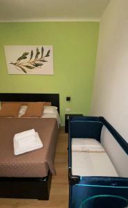 Letto o letti in una camera di L'Ulivo in Centro