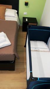 Letto o letti in una camera di L'Ulivo in Centro