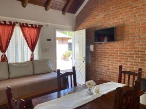 a living room with a couch and a table at TOLHUIN COLON in Colón