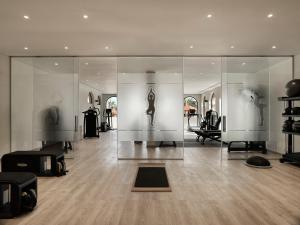 a large room with glass walls and sculptures on display at The Chedi El Gouna in Hurghada