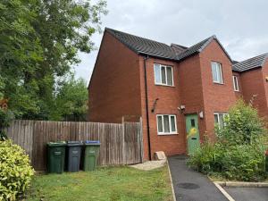 a brick house with two trash cans in front of it at New Stylish House - Sleeps 7 - Free Parking - Contractors Welcome - Wifi in Birmingham