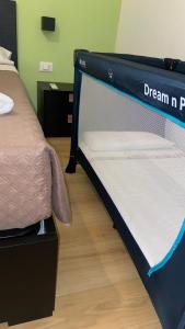 Letto o letti in una camera di L'Ulivo in Centro