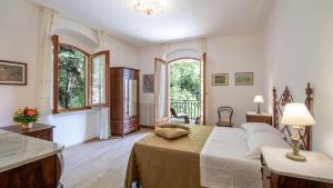 Giường trong phòng chung tại Villa Il Masseto