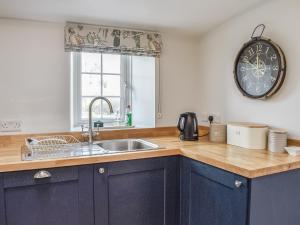 Kuchyň nebo kuchyňský kout v ubytování Crogen Gatehouse Lodge